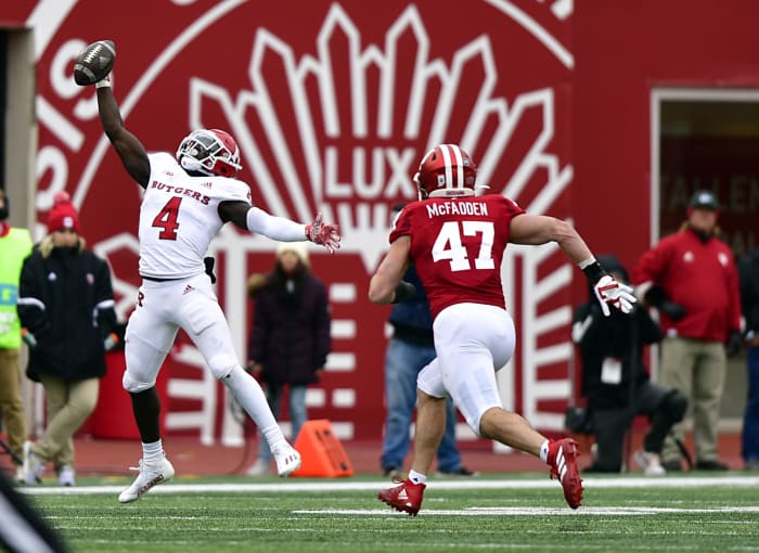 Nov 13, 2021; Bloomington, Indiana, USA; Rutgers Scarlet Knights running back Aaron Young (4) misses a pass in front of Indiana Hoosiers linebacker Micah McFadden (47) during the second half at Memorial Stadium. The Scarlet Knights won 38-3.